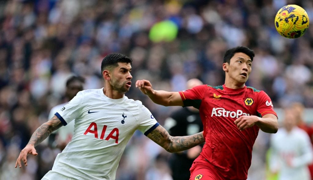 Cristian Romero battles Hwang Hee-chan during Tottenham against Wolverhampton Wanderers in the Premier League.