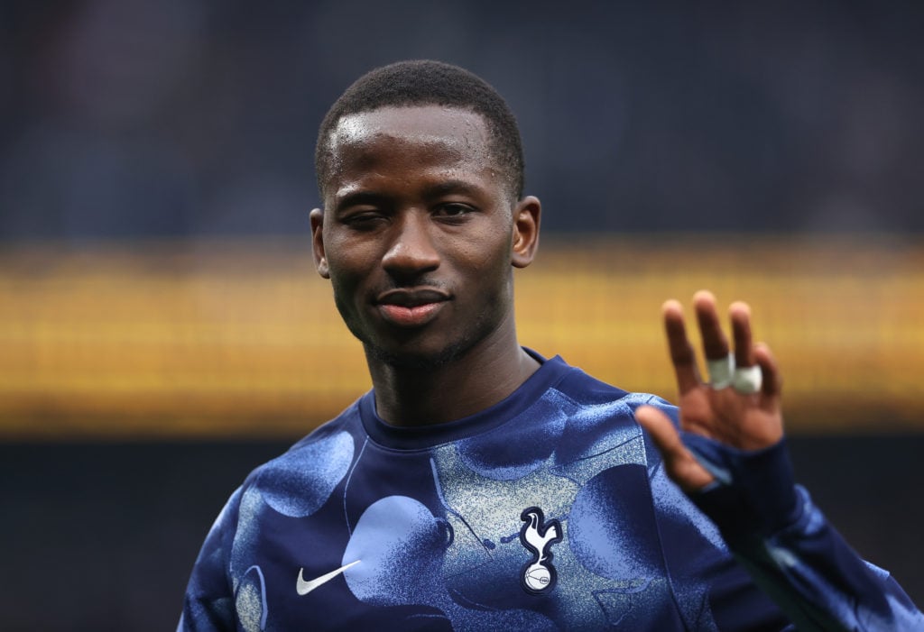 Tottenham midfielder Pape Matar Sarr waving