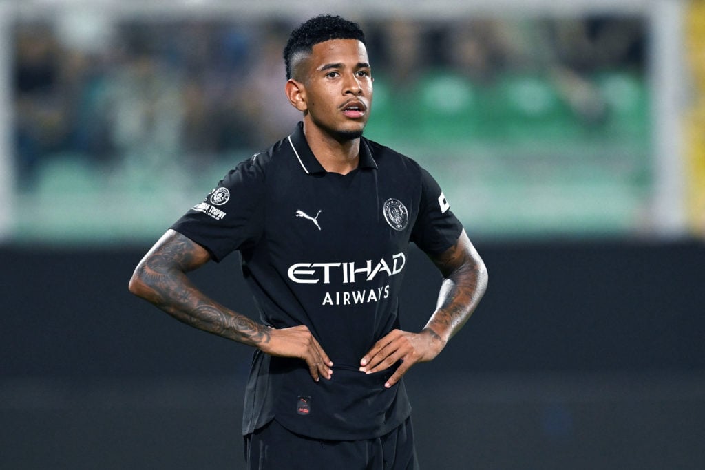 Manchester City winger Savinho standing