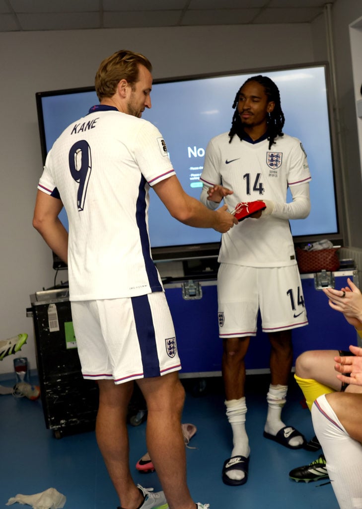 Harry Kane presenting Djed Spence with a legacy cap after his England debut against Serbia.