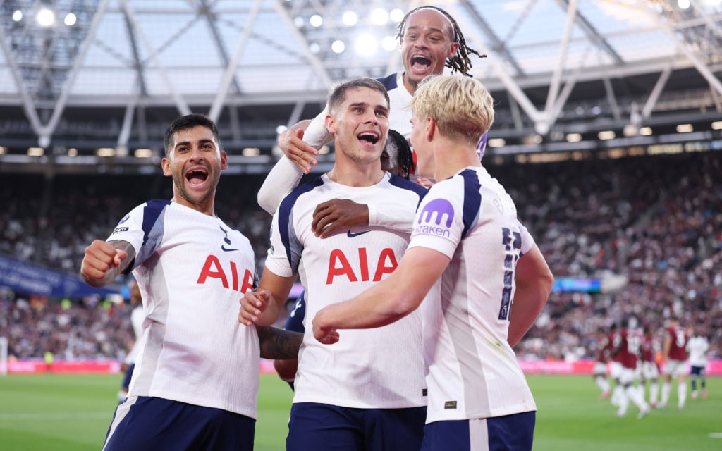 Tottenham players celebrate with teammate Micky van de Ven after his goal against West Ham in the Premier League.
