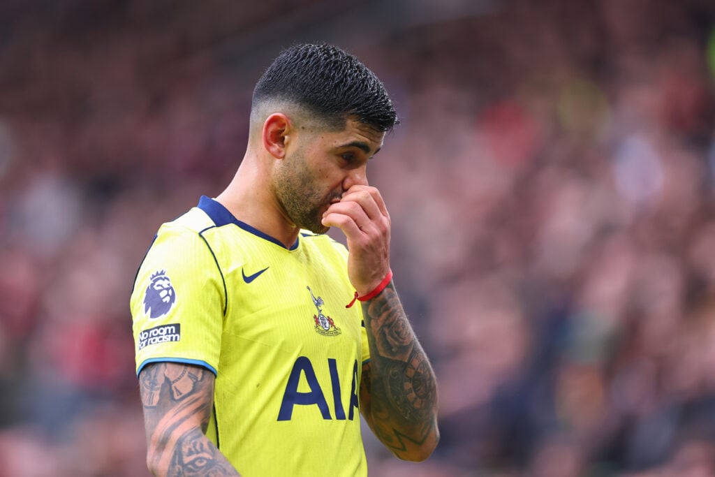 Tottenham's Cristian Romero reacts to his red card.