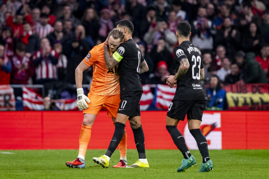 Tottenham goalkeeper Antonin Kinsky is consoled by Cristian Romero